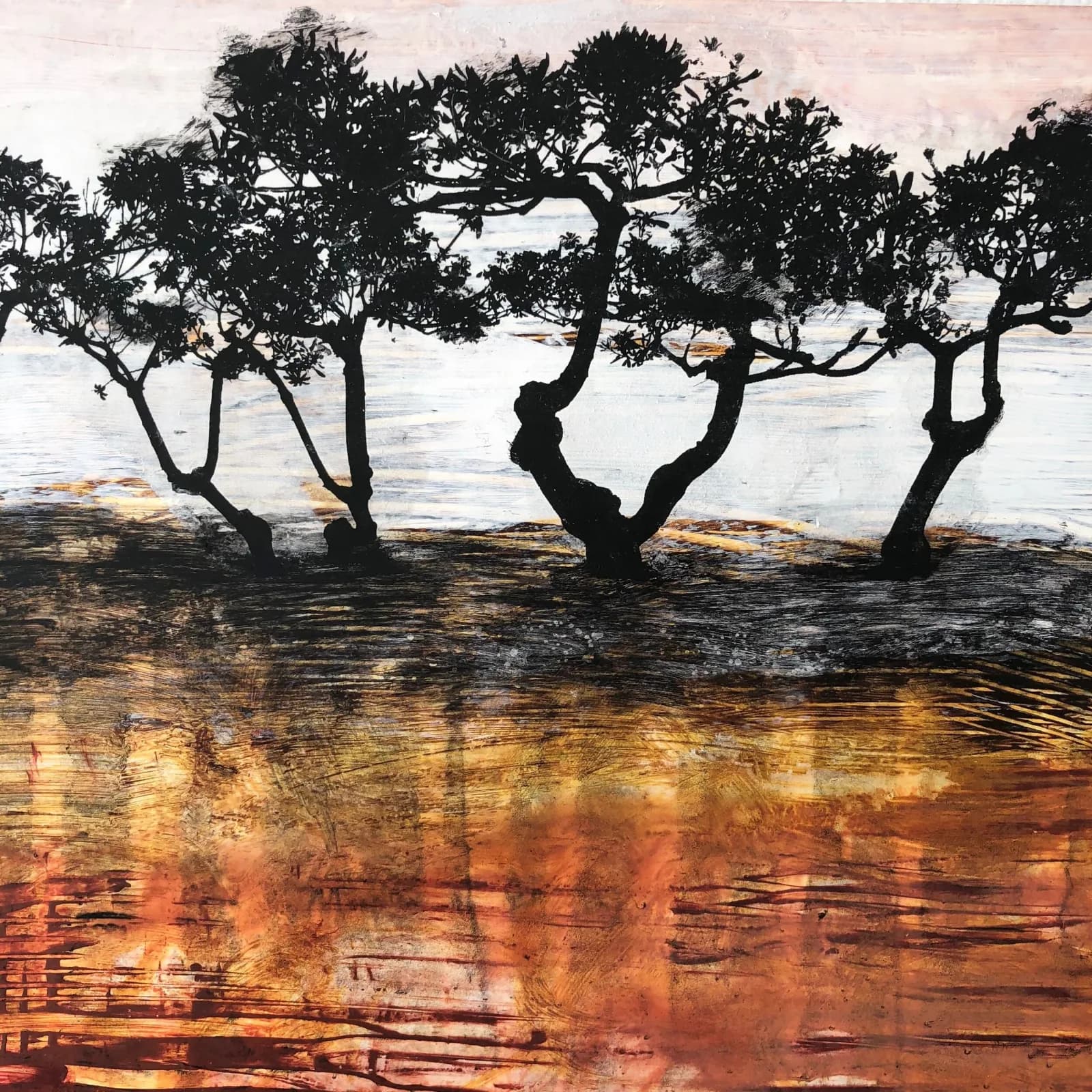 Silhouetted mangrove trees at a sandy shoreline with warm-toned water reflections in mixed media.