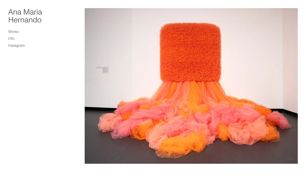 Fiber sculpture with layered orange and pink textile elements in an organic, non-representational form.
