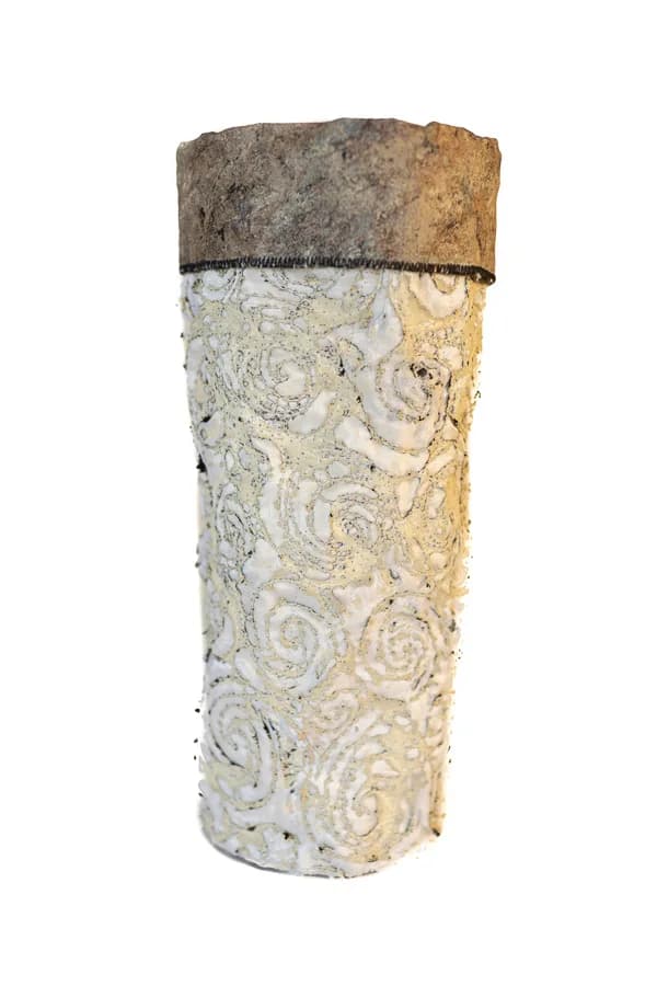 Abstract ceramic vessel with carved spiral and organic surface detail in cream and natural clay tones.