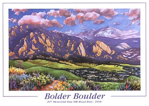 The Boulder Flatirons rise above a green valley dotted with wildflowers in this acrylic landscape painting.