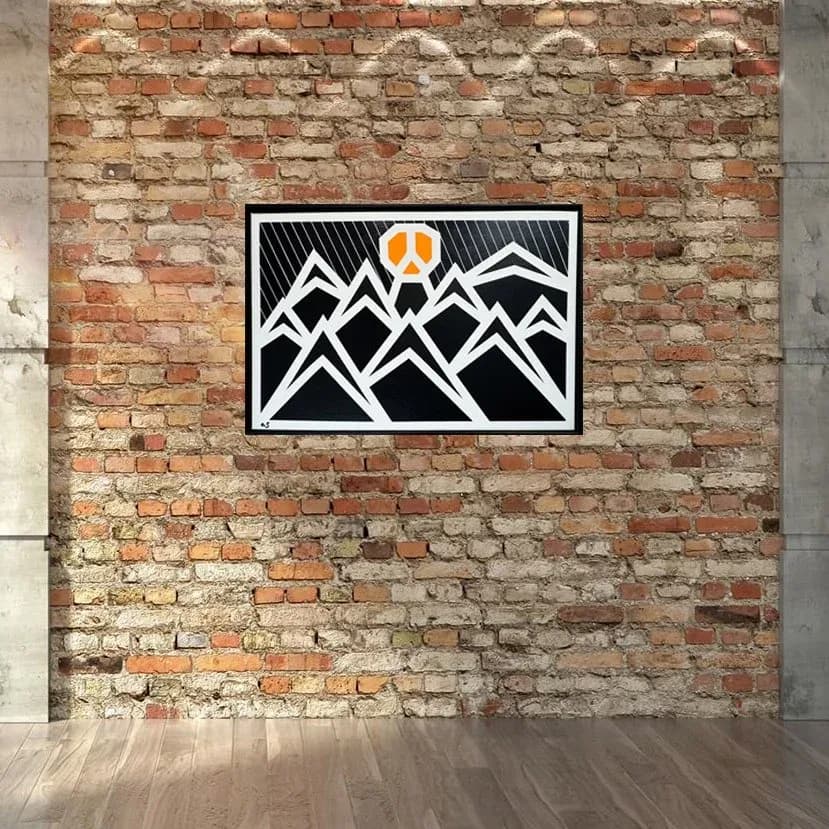 Geometric mountain landscape with orange sun, rendered in bold black-and-white linocut or woodblock print style, evokes the Boulder Flatirons.