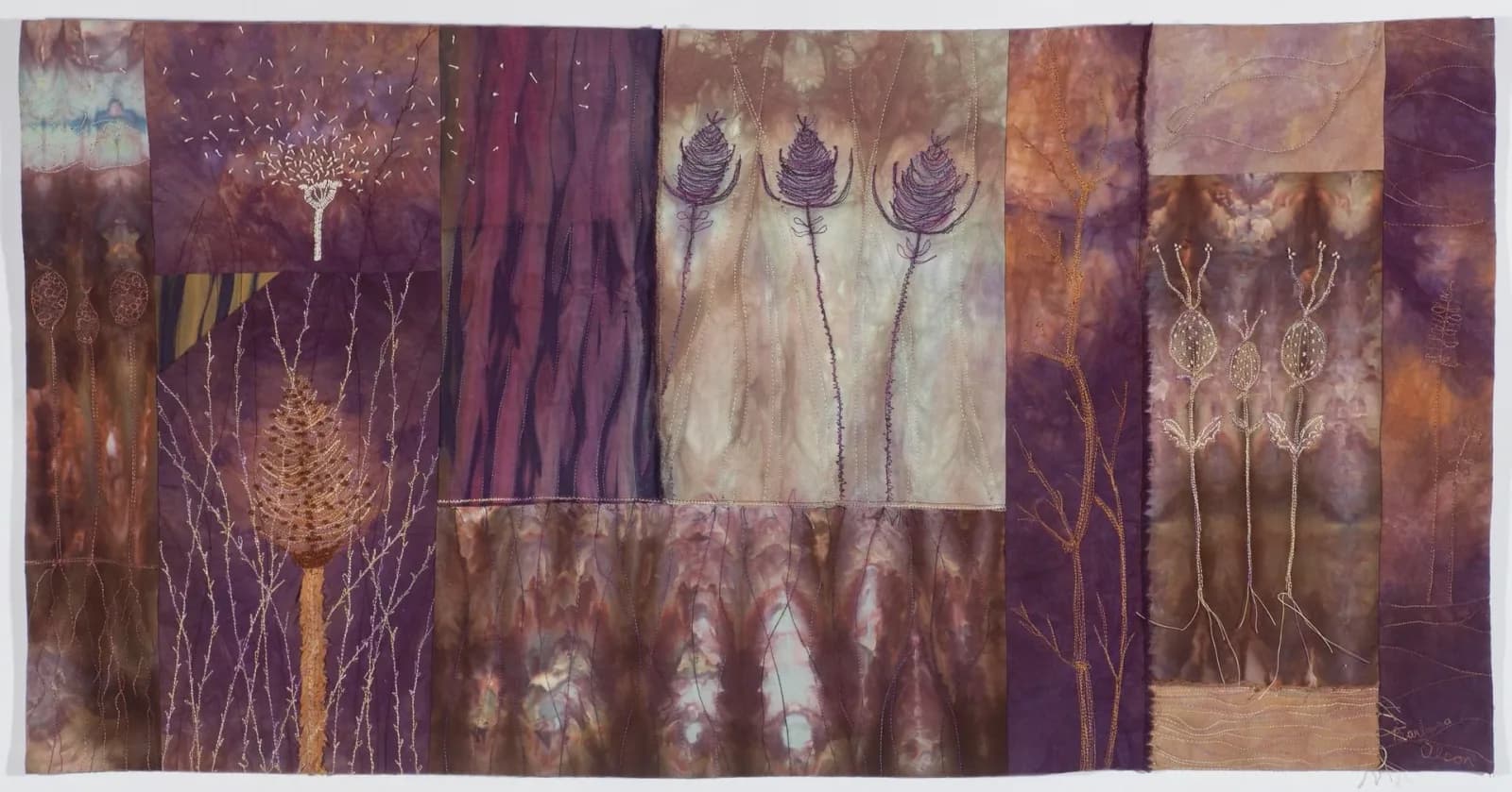 Botanical fiber artwork with patchwork panels in purple, gold, and brown tones, featuring stylized plants and seed heads.