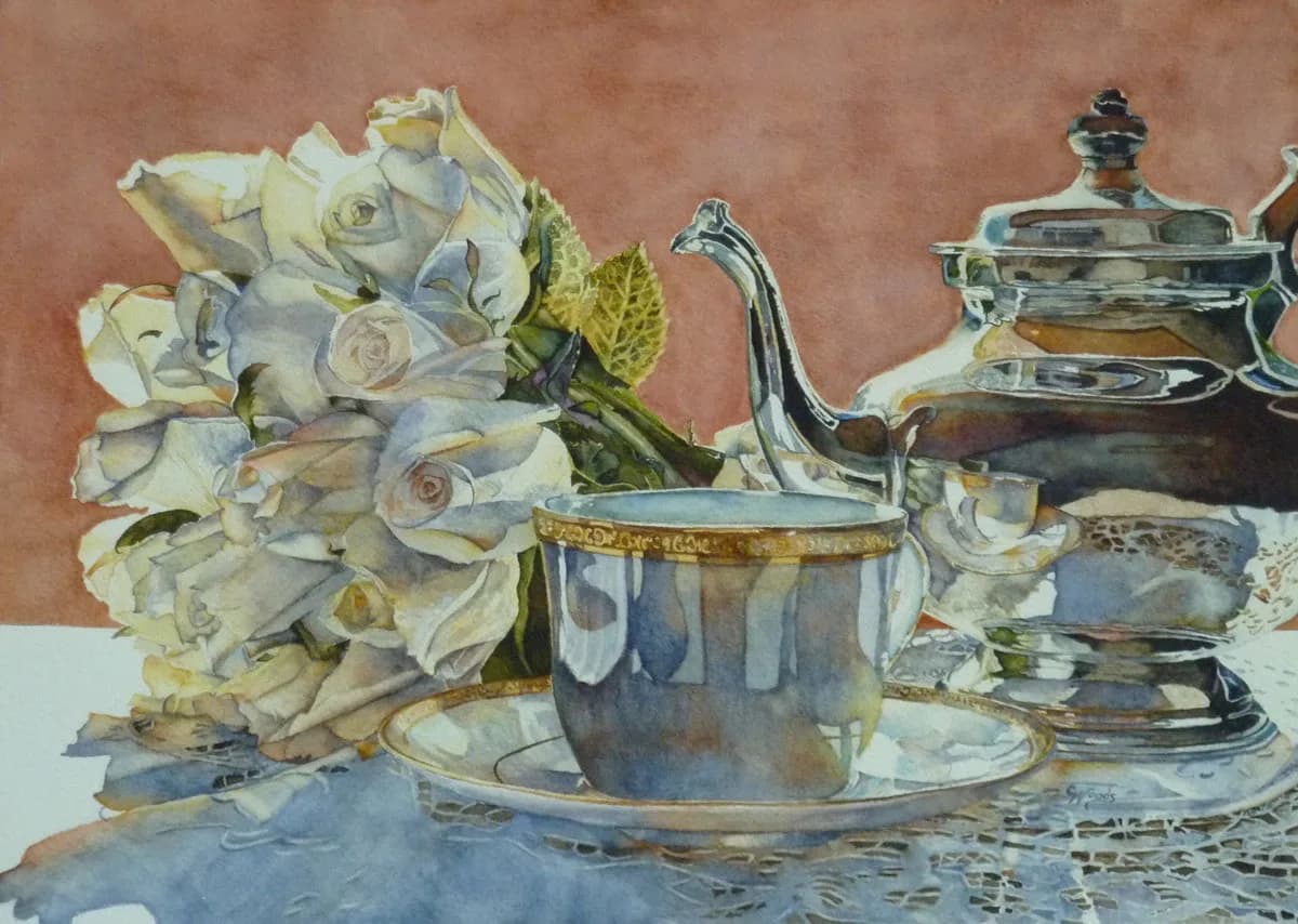 A still life composition of pale roses in a vase alongside silver teapots and delicate lace on a neutral background.