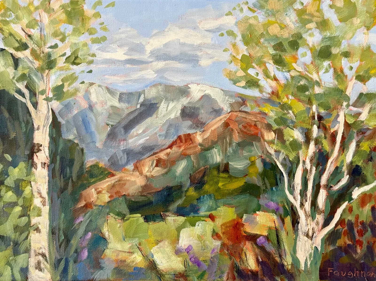 Aspen trees frame a view of the tilted red-rock Boulder Flatirons rising beyond a sunlit valley.