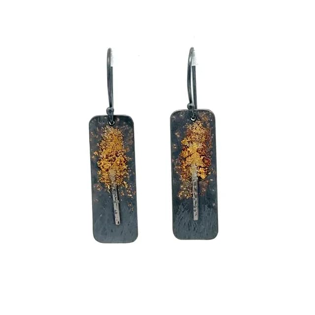 Pair of mixed-metal rectangular earrings with oxidized finish and gilded tree motif.