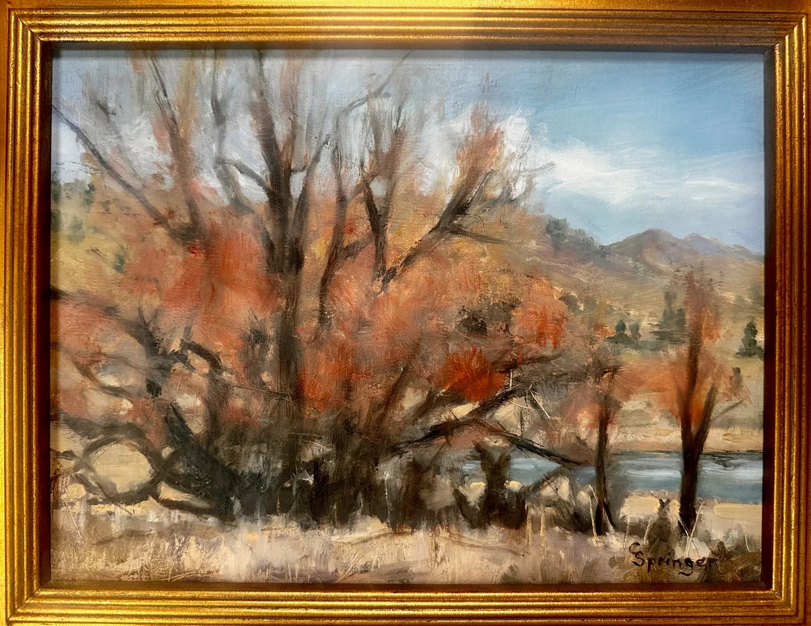 Oil painting of bare cottonwood trees in autumn overlooking the Boulder Flatirons and river valley.
