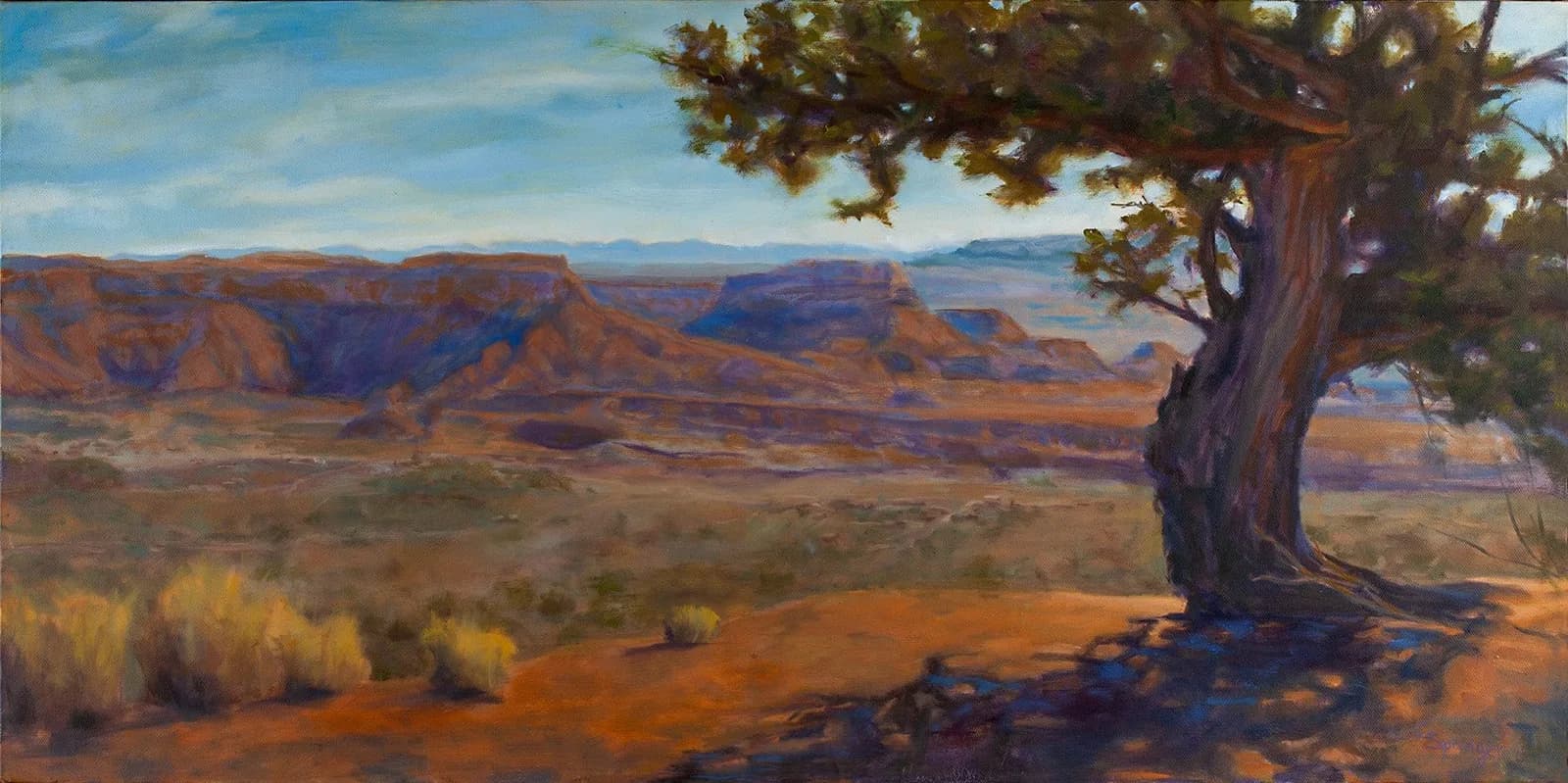 Desert landscape with a gnarled juniper tree and distant canyon buttes in warm earth tones.