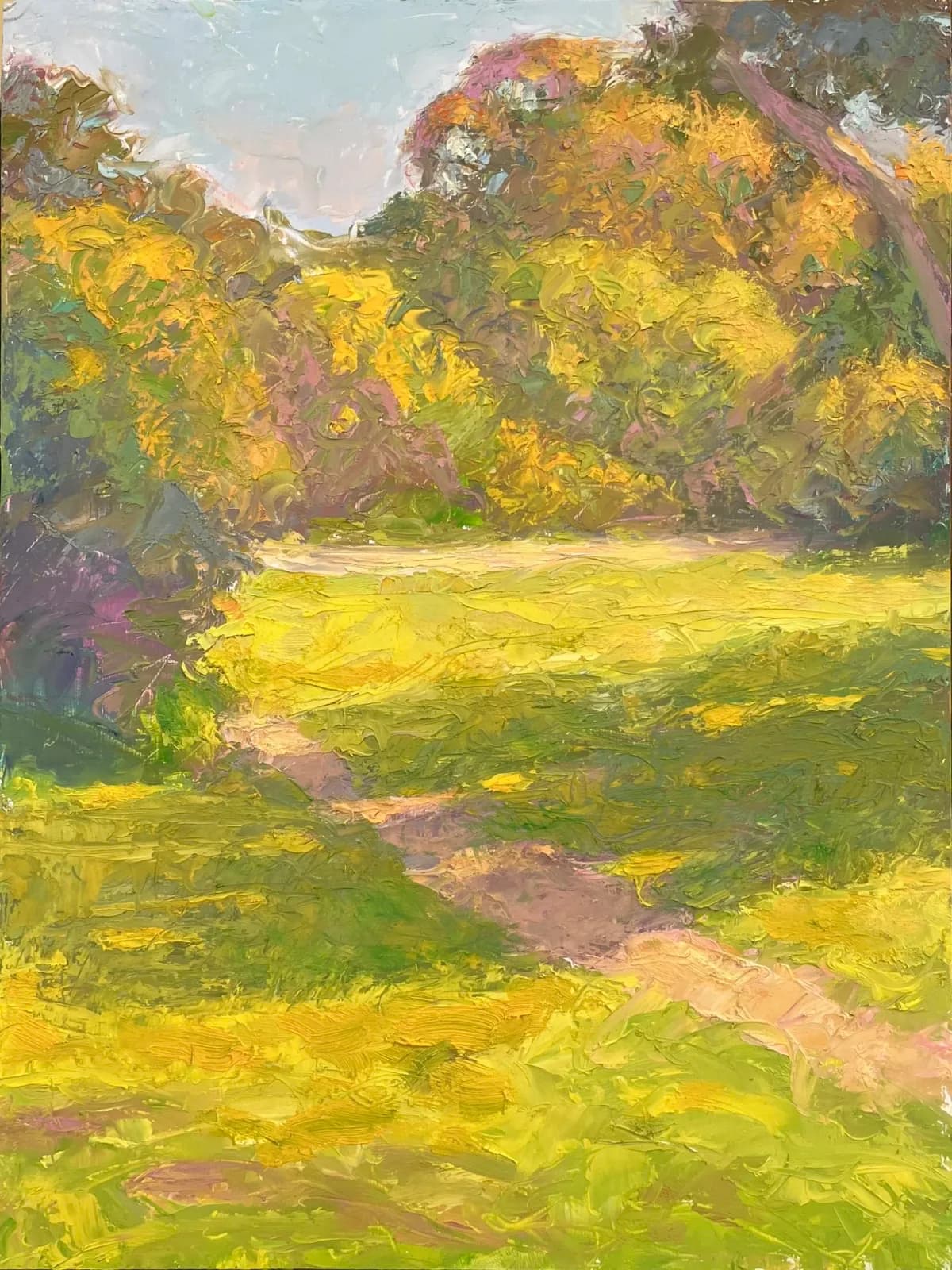A sunlit meadow with golden grasses and tree-lined ridges rendered in oil with loose, luminous brushwork.