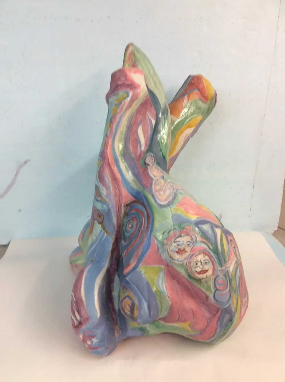 Hand-painted ceramic sculpture with abstract geometric forms and playful figural motifs in vibrant multi-color glaze.