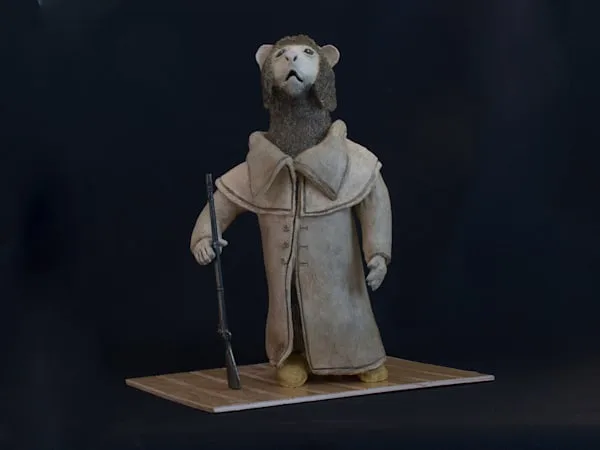 Wooden carved figure of an anthropomorphic bear wearing a nautical jacket and holding a rifle.