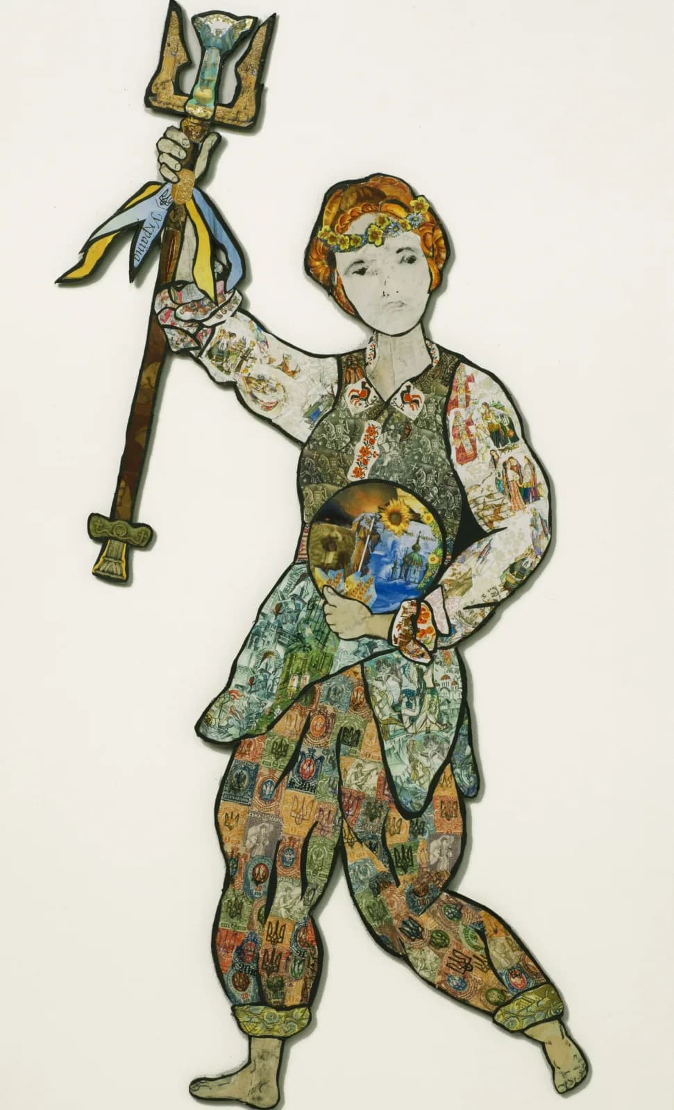 A robed figure holding an ornamental staff, body filled with intricate patterned imagery in ink and watercolor.