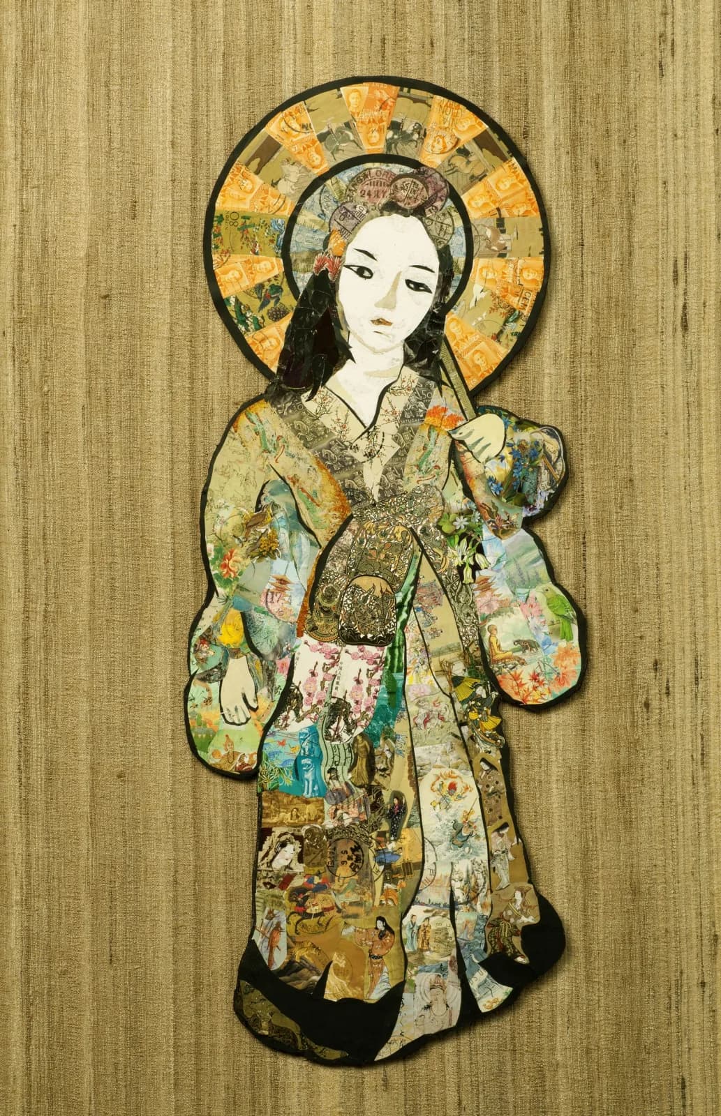A stylized female figure adorned with a golden halo, rendered in collage and mixed media on textured paper.