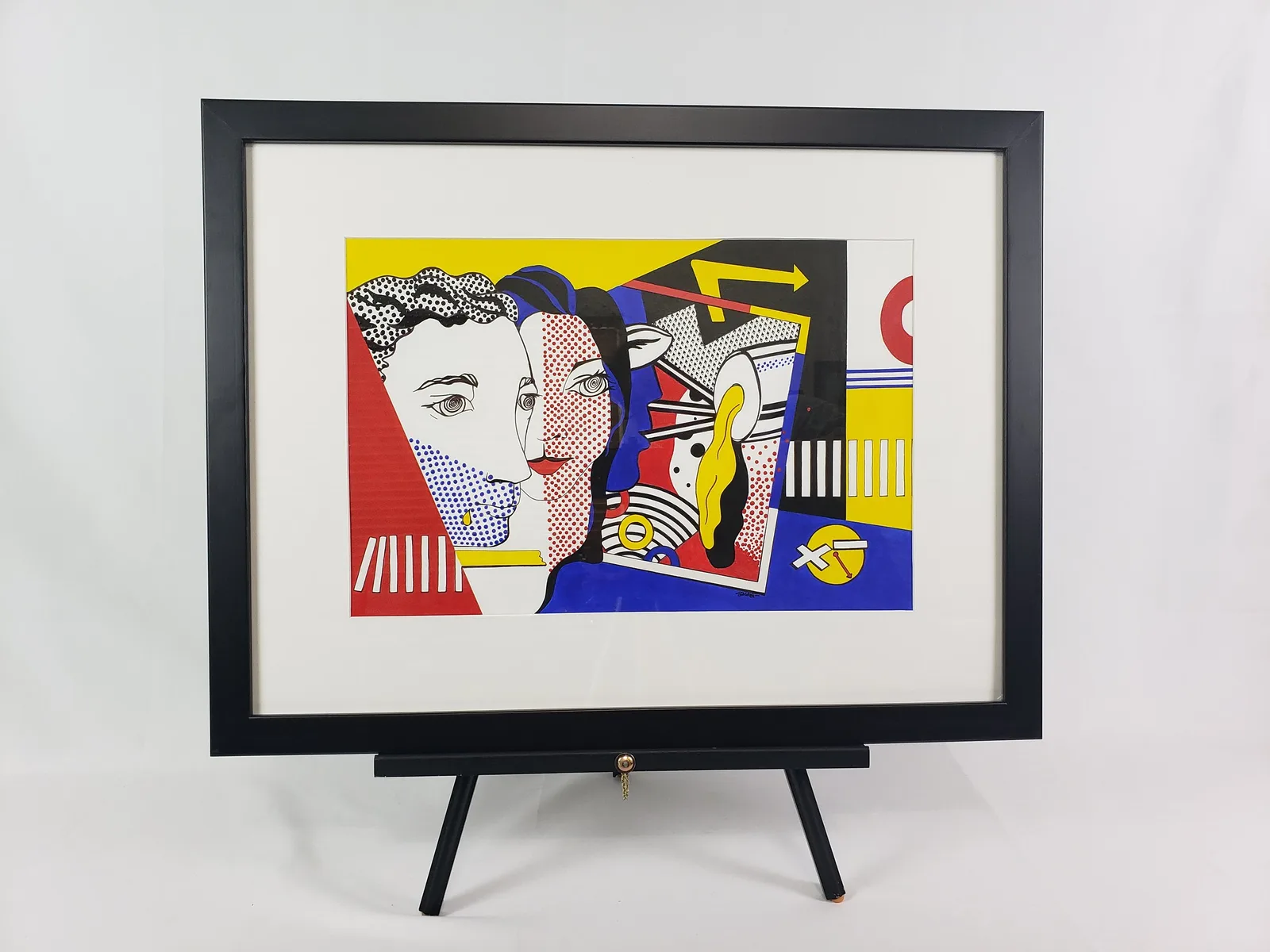 Abstract portrait with geometric planes and bold primary colors in a framed print.