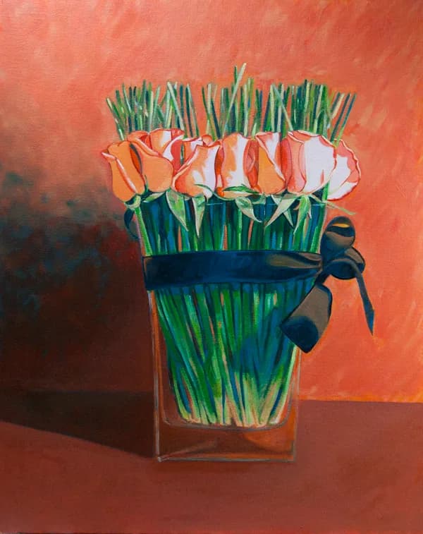 A bouquet of coral roses with green stems bound by a dark ribbon in a clear glass vase.