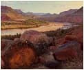 Sunlit desert landscape with warm ochre and rust tones, distant mountains, and layered terrain rendered in oil.