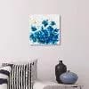 Blue monotype floral composition with layered petals and organic forms on white paper.