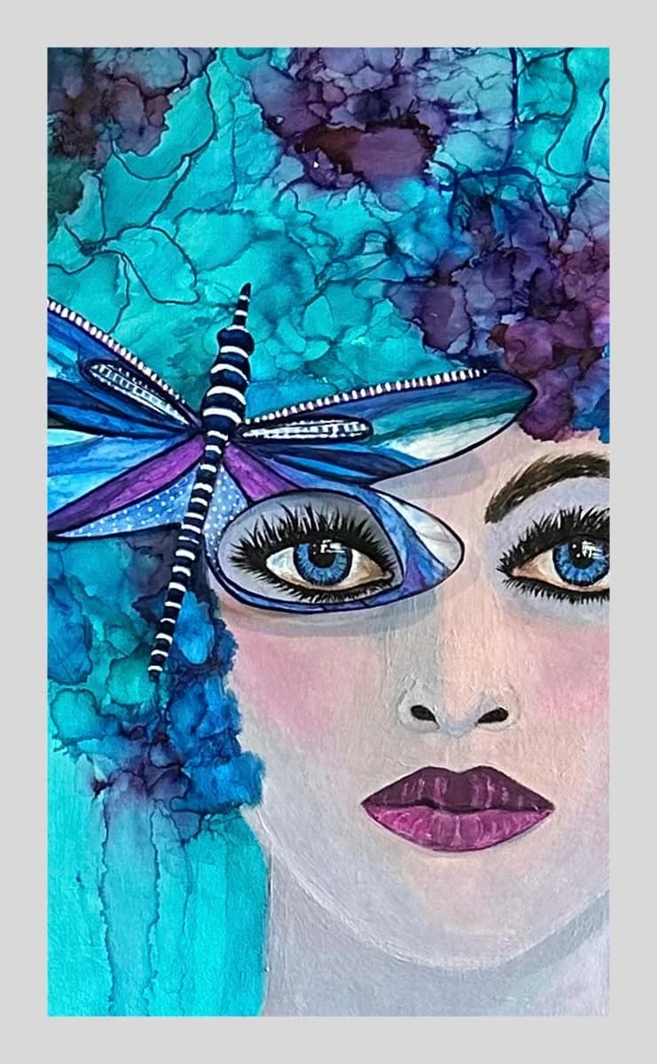 Portrait of a face with blue eyes and purple lips adorned with a turquoise and purple dragonfly.