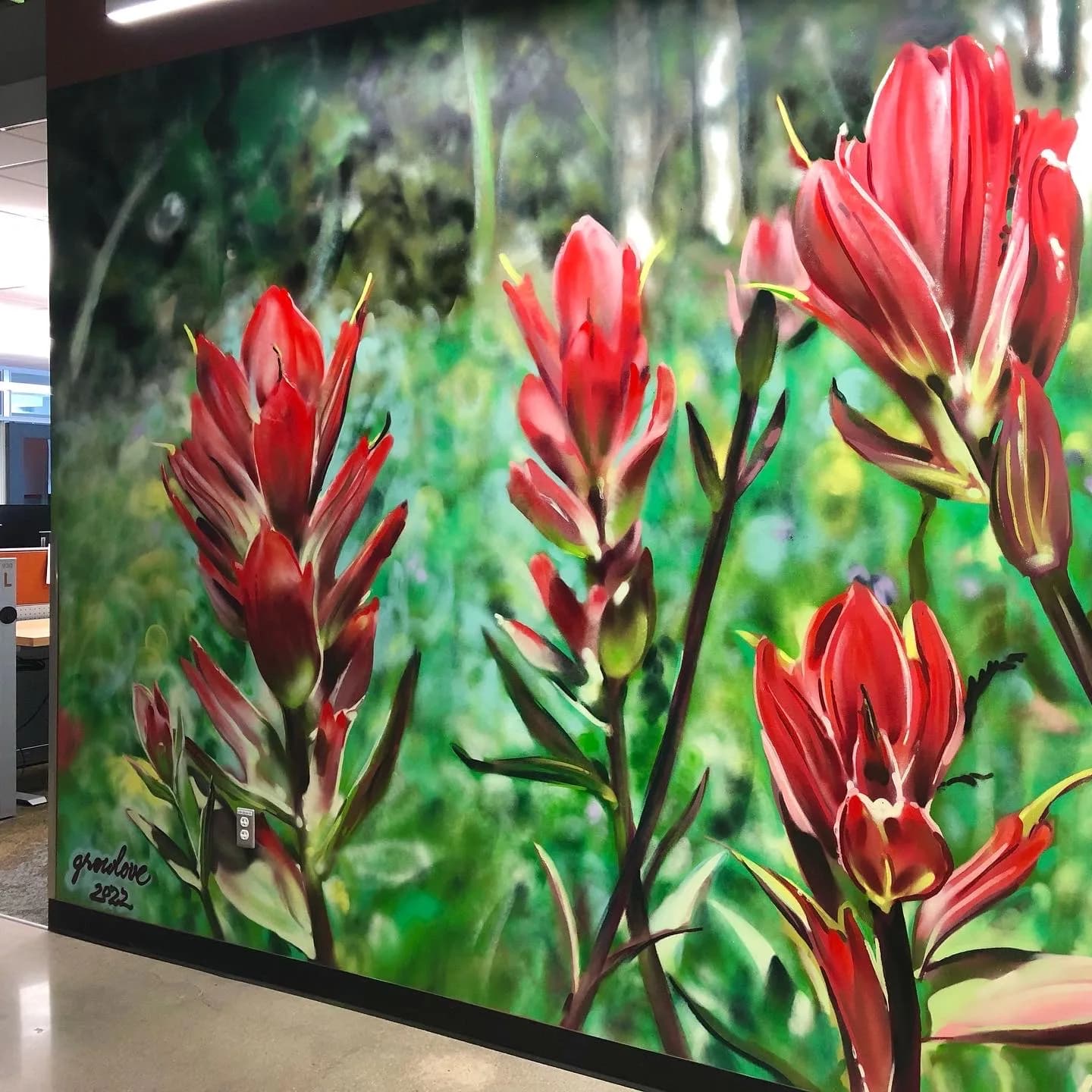 Red flowers in lush green foliage, rendered in rich acrylic pigment with painterly brushwork.