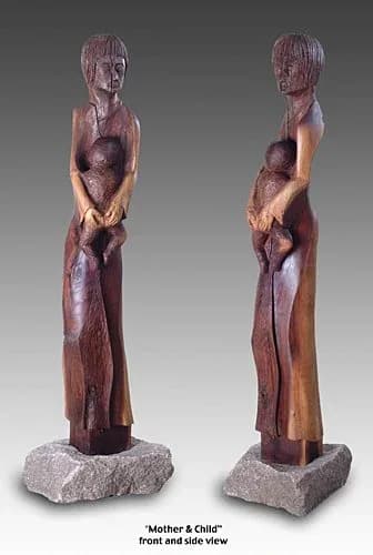 Wooden carved sculpture depicting a mother and child in an embracing pose, shown in front and side views.