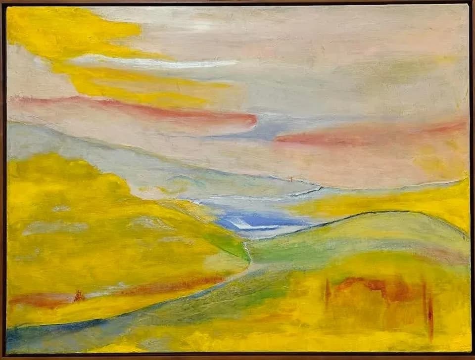 Oil painting of a rolling landscape with golden hills, a distant valley, and luminous sky.