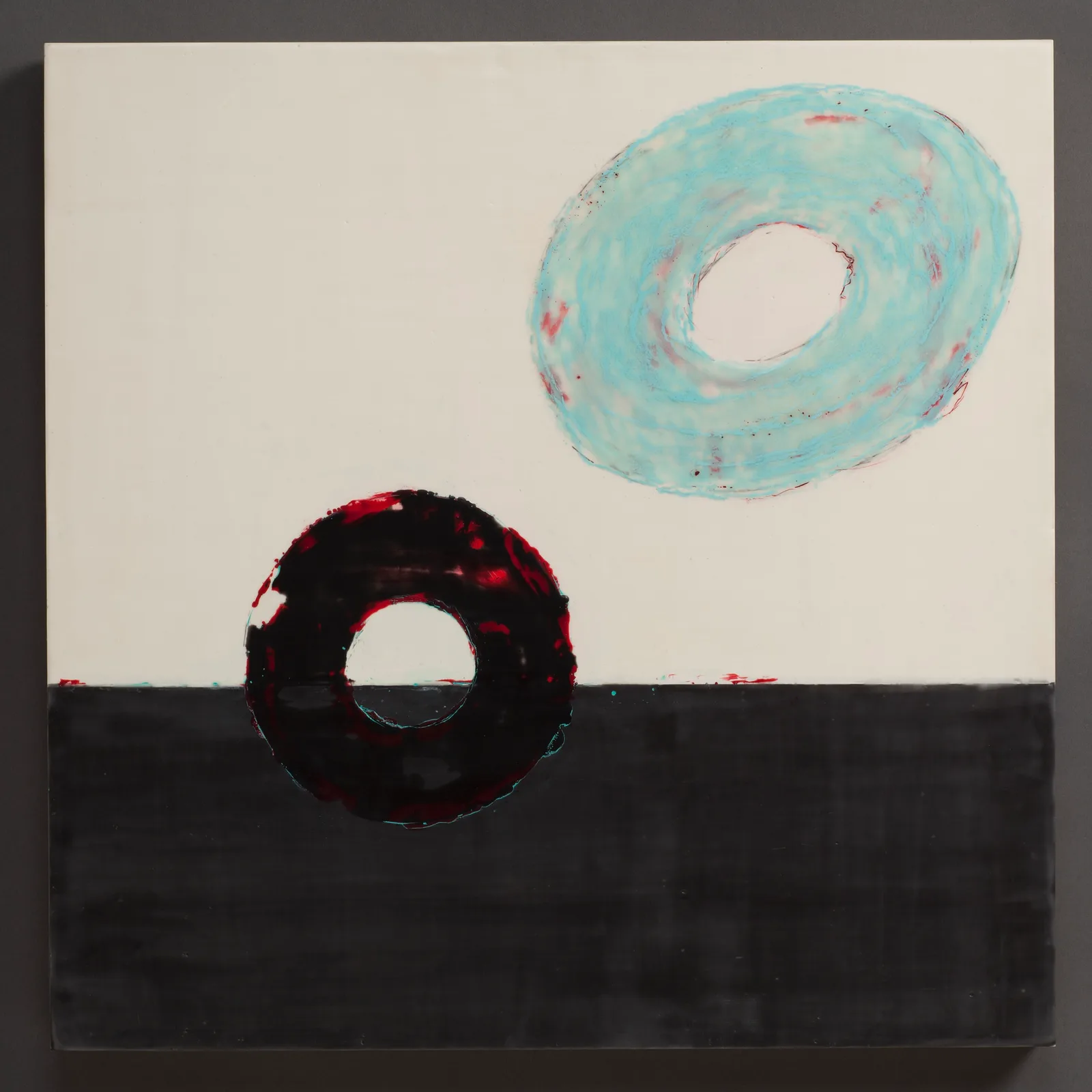 Two hollow circles—one turquoise, one deep red and black—float above a dark horizon in acrylic paint.