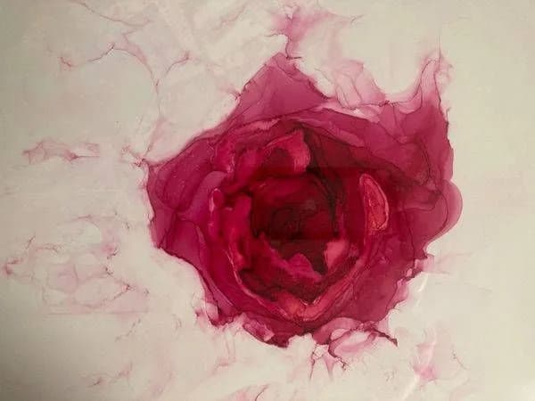 A deep paprika rose unfolds in soft watercolor washes across a cream background.