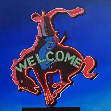 A neon sign depicting a bucking horse and cowboy rider in red and blue tubing against a dark background.