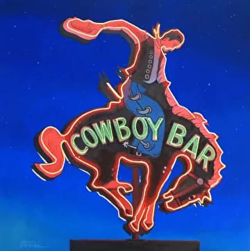 Vintage neon sign depicting a bucking cowboy and horse against a starlit sky, glowing in sanguine and gold.