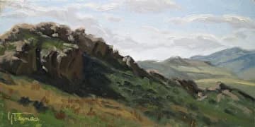 Oil painting of a rocky outcrop rising from a green meadow and distant foothills, en plein air study.