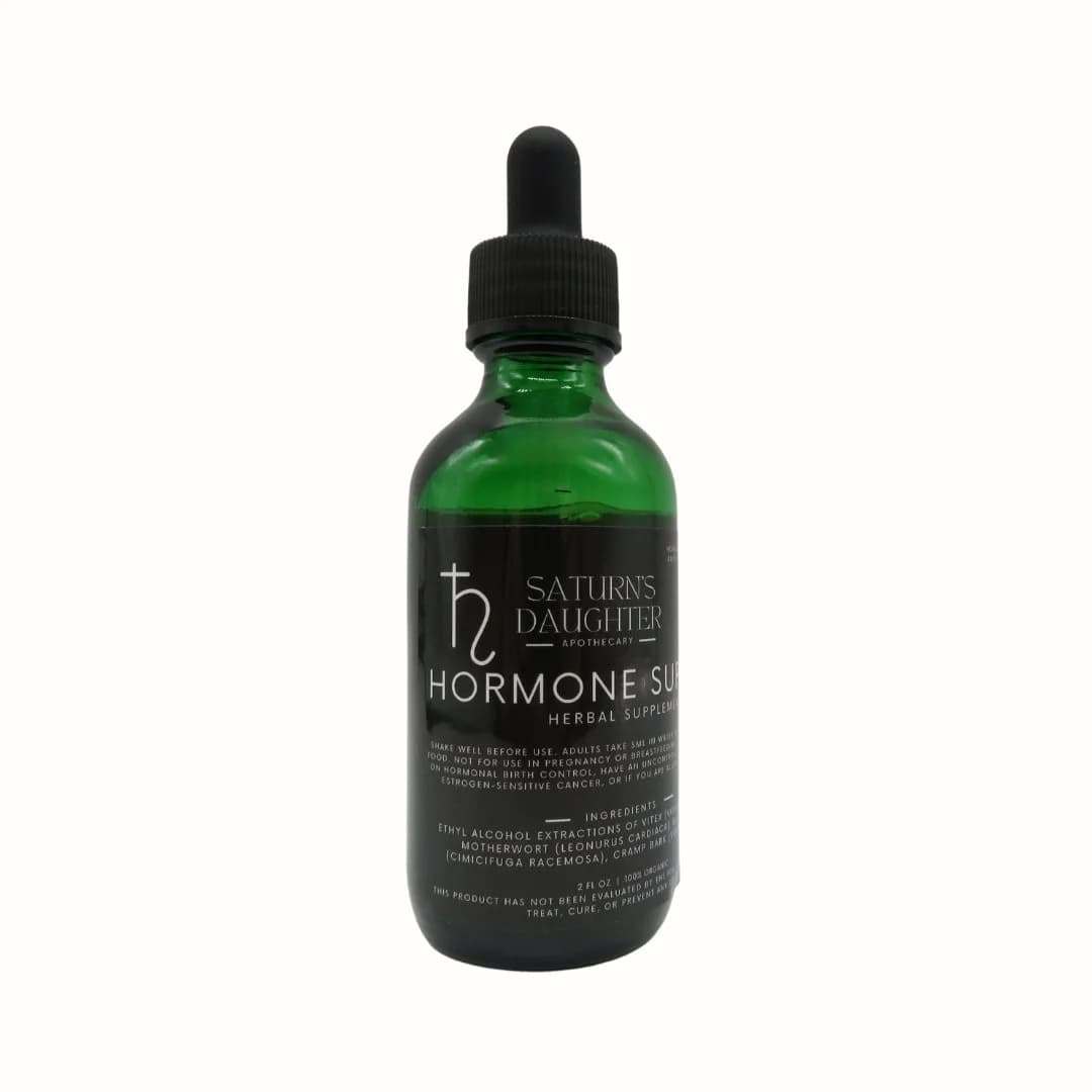 Product photograph of a green glass bottle with dropper top and label.